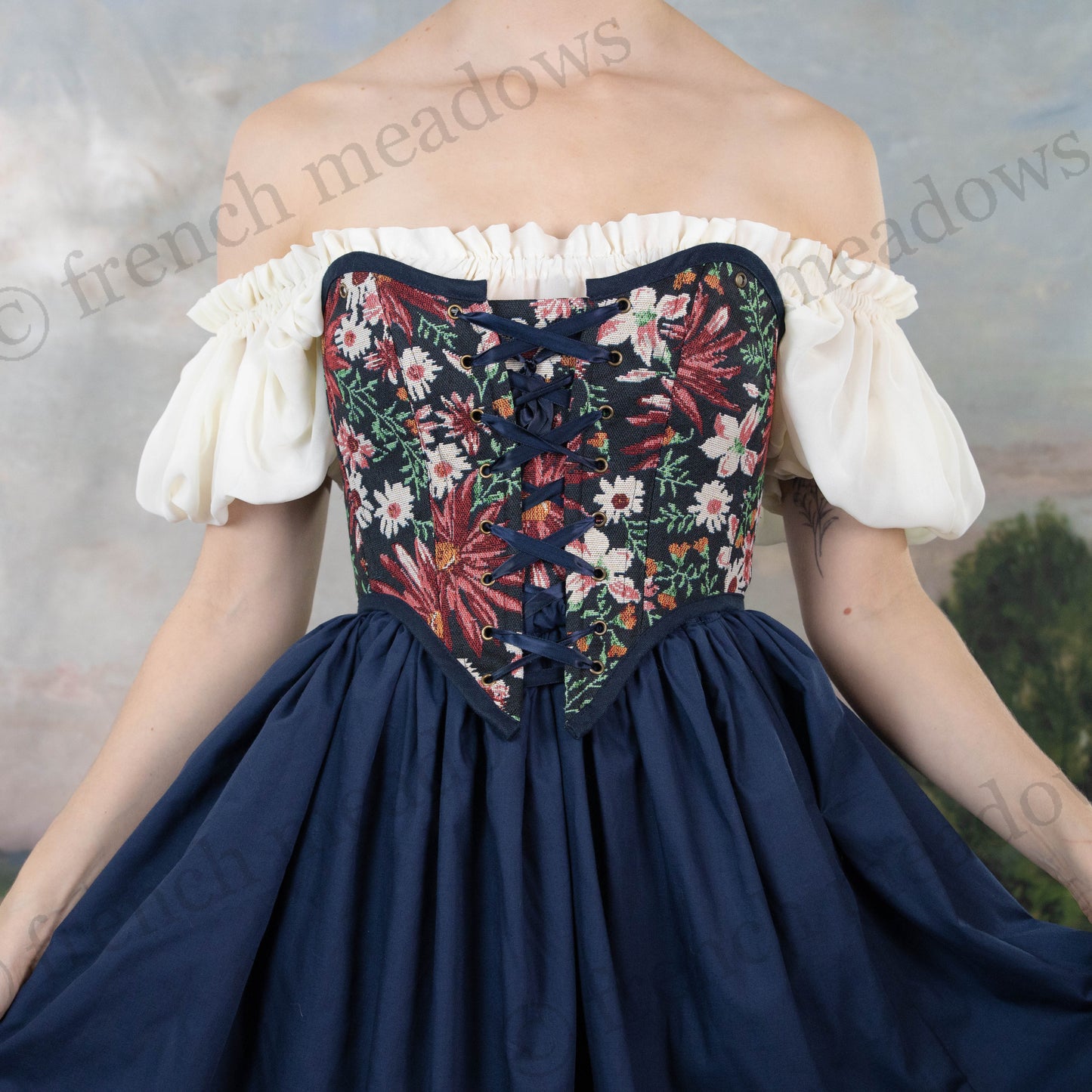 model wearing strapless dark blue corset bodice