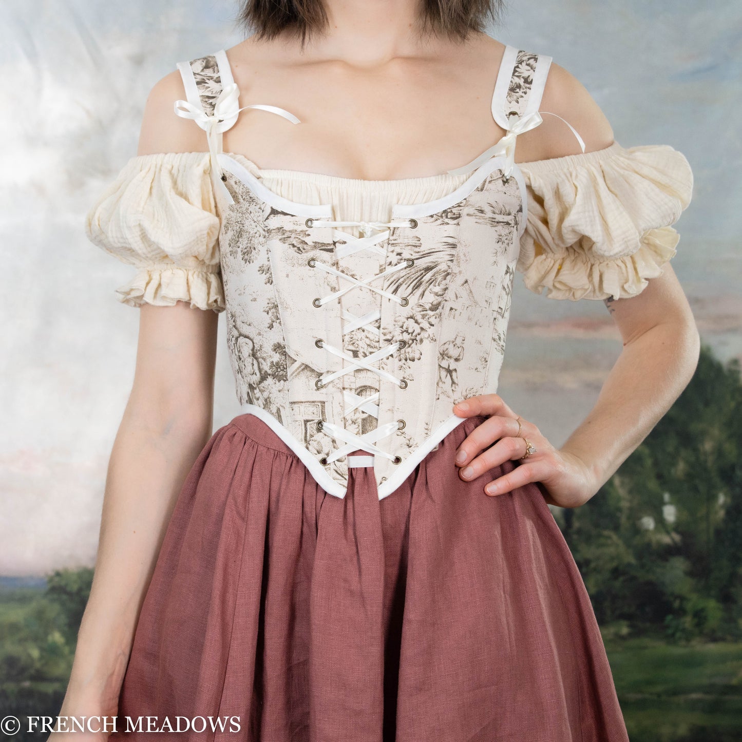model wearing ivory and brown corset made from toile du jouy fabric