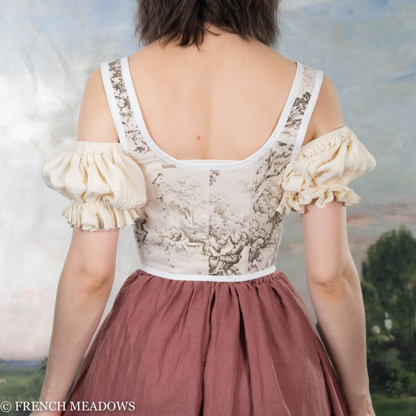 back view of a model wearing a renaissance bodice in brown cotton linen fabric