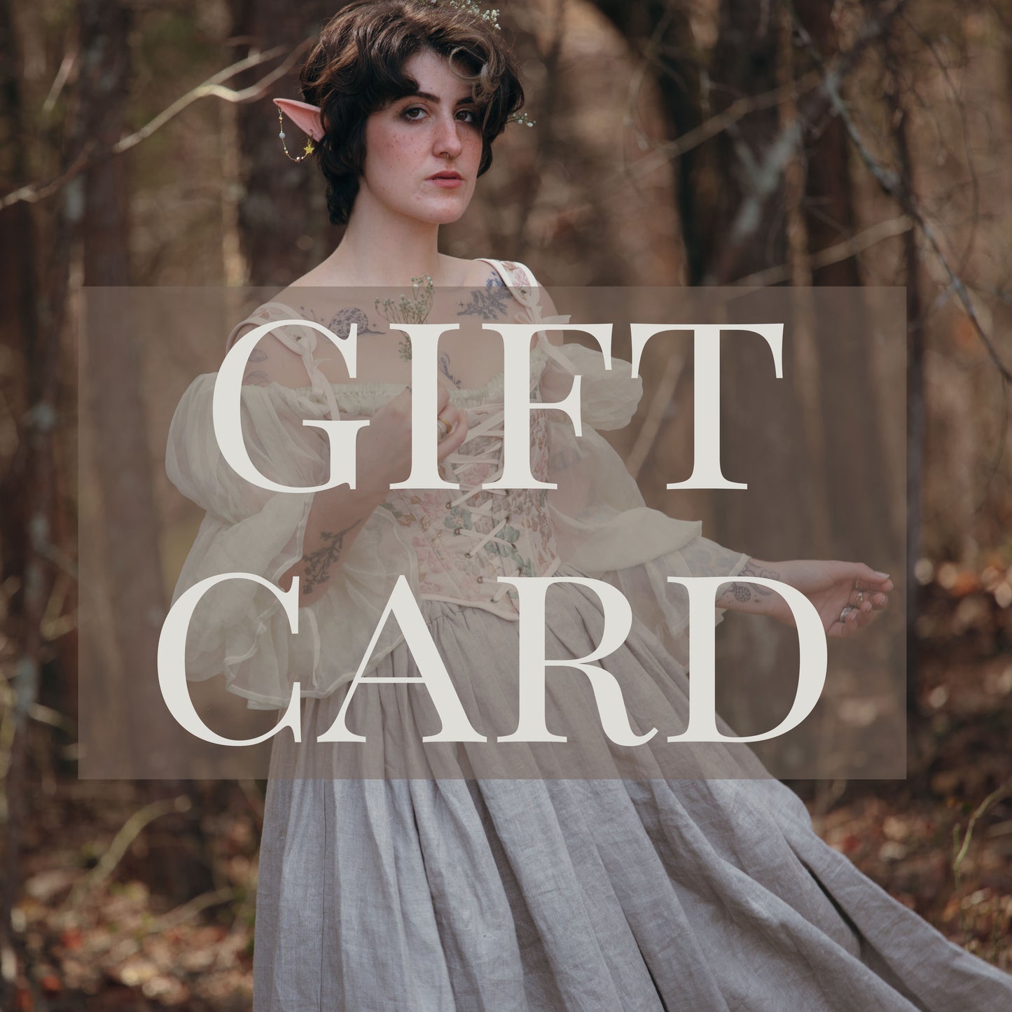 female model wearing a fairy costume with the words gift card written on top