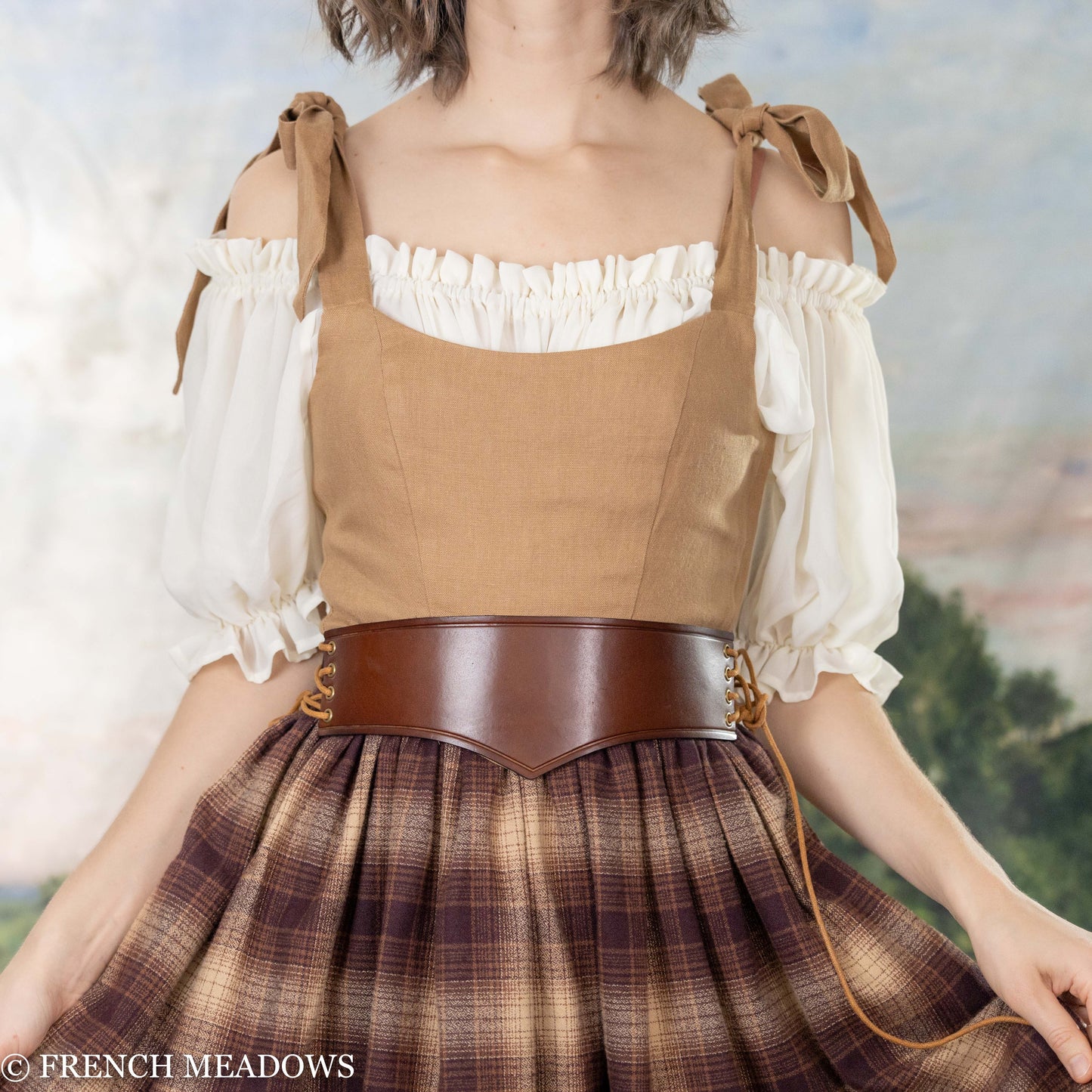 Load image into Gallery viewer, model wearing a renaissance faire costume with an unboned corset
