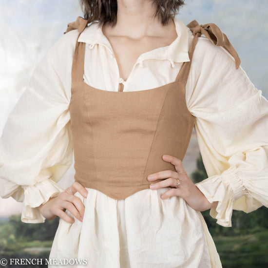 Load image into Gallery viewer, model wearing light brown fitted top over a medieval tunic
