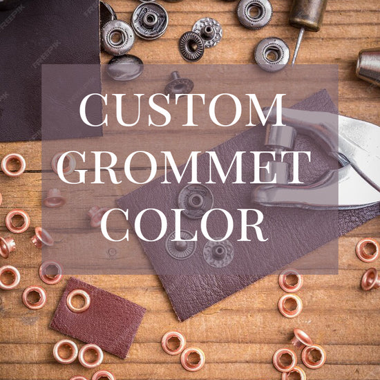metal grommets in gold and gunmetal color sprawled across a table with the words custom grommet color written on top