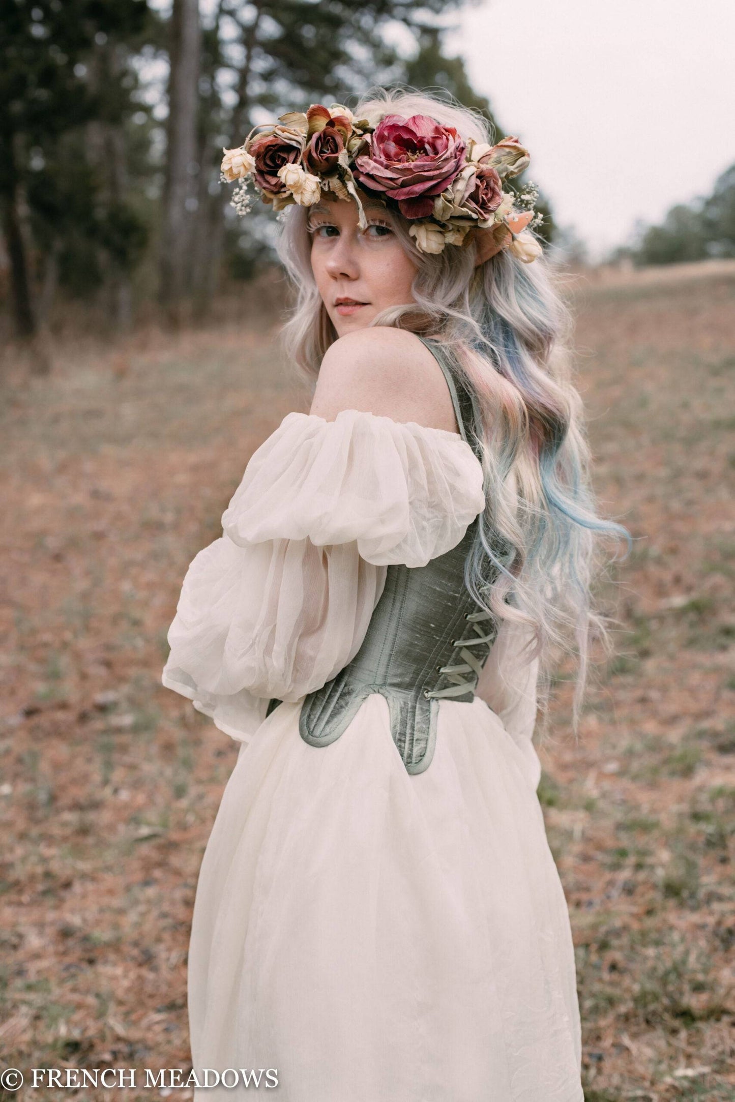 a fairy wearing a sheer silk dress