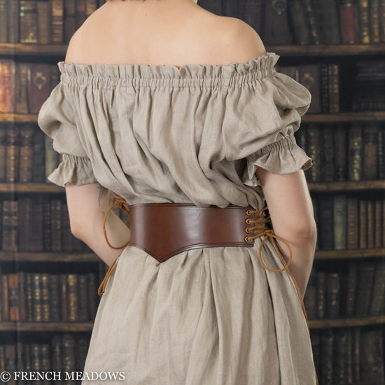 back view of pointy leather waist belt