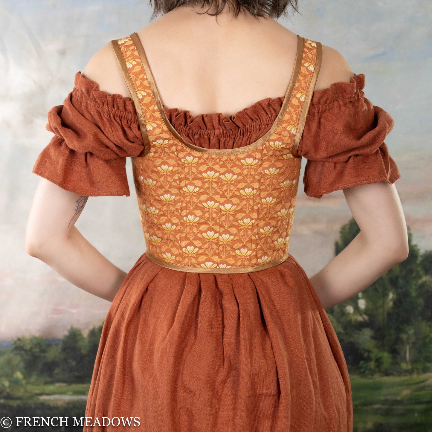 Load image into Gallery viewer, back view of a model wearing an orange corset dress

