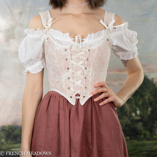 Load image into Gallery viewer, model wearing a pink renaissance bodice and off the shoulder blouse in a tavern wench style
