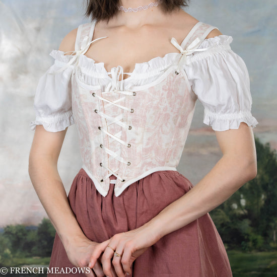 Load image into Gallery viewer, side view of model wearing a pink renaissance faire costume
