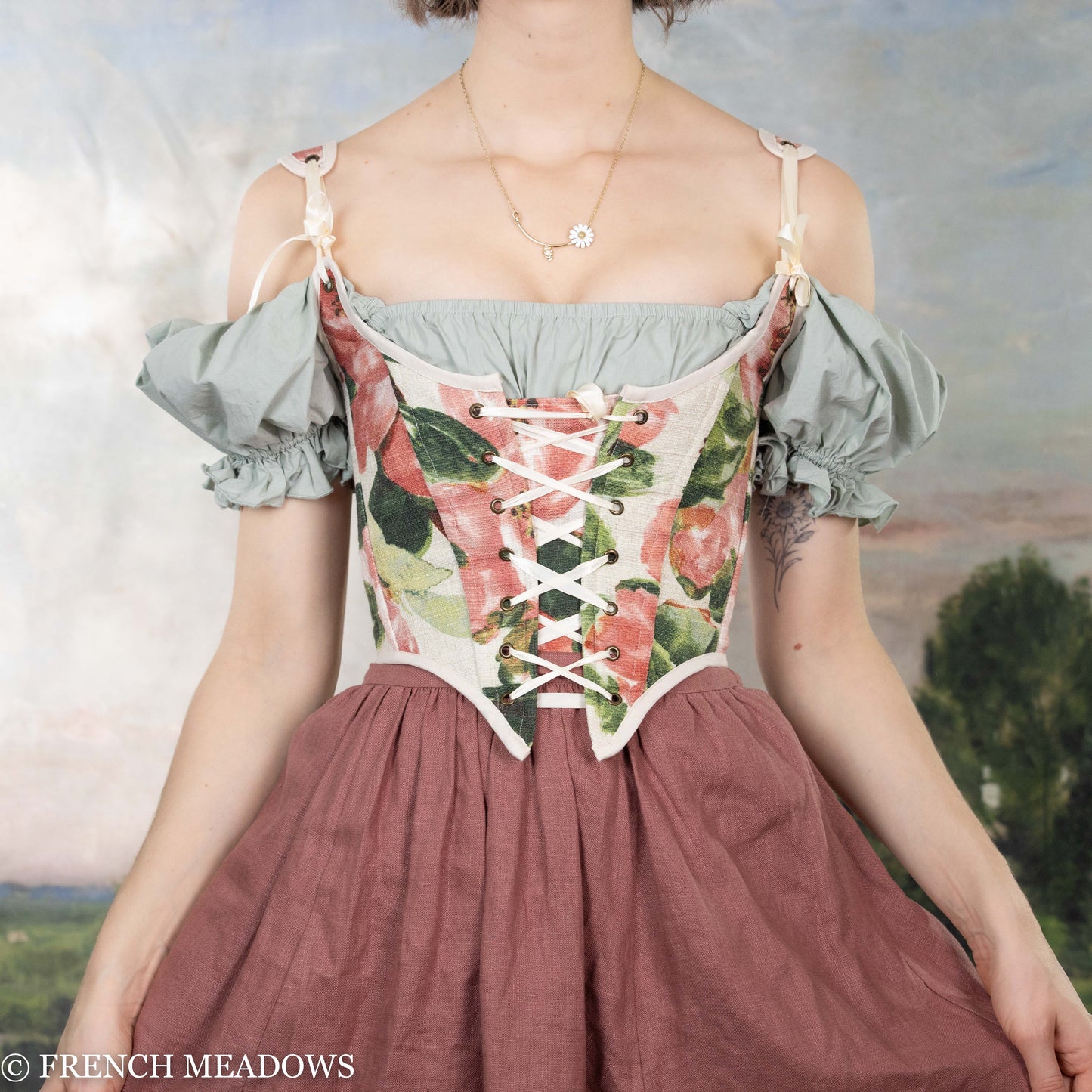 mode wearing pink floral corset top with pink peonies and green leaves