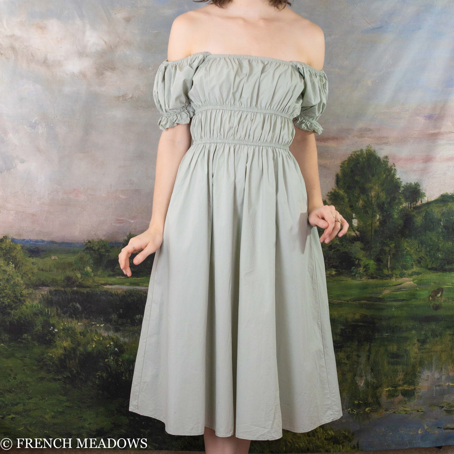 Load image into Gallery viewer, modeling wearing light green cotton dress off her shoulders
