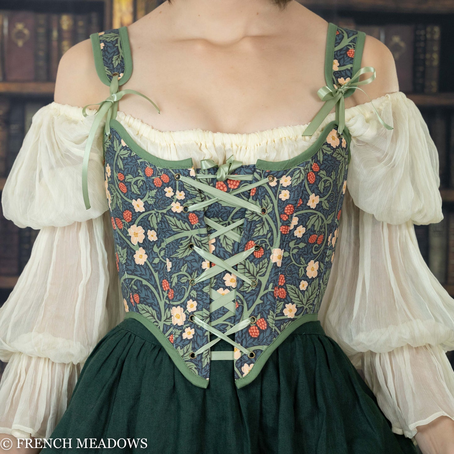Load image into Gallery viewer, model wearing a corset top with a floral green fabric featuring vines, leaves, and raspberries
