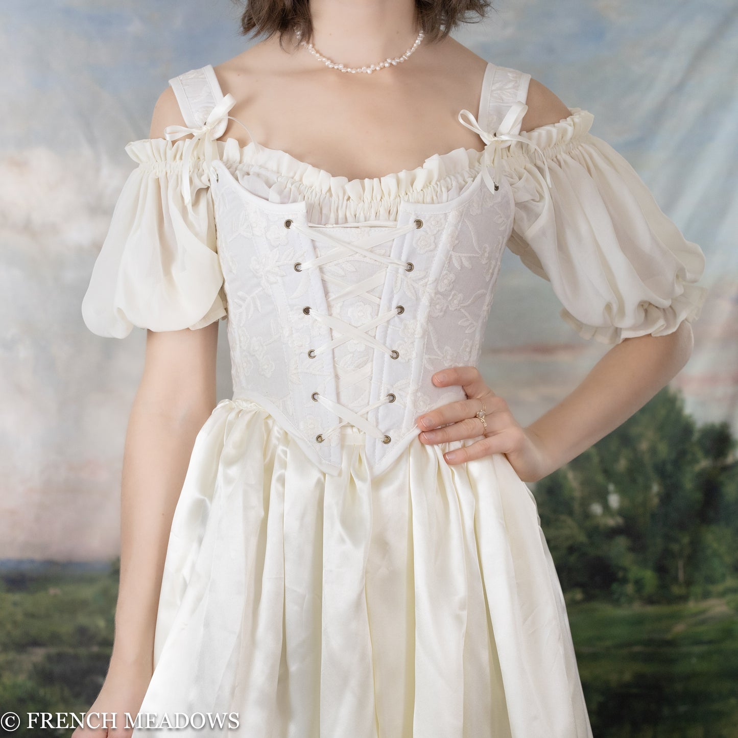 Load image into Gallery viewer, model white floral corset top with white satin skirt
